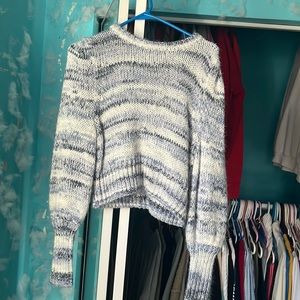 blue, white, and grey sweater.